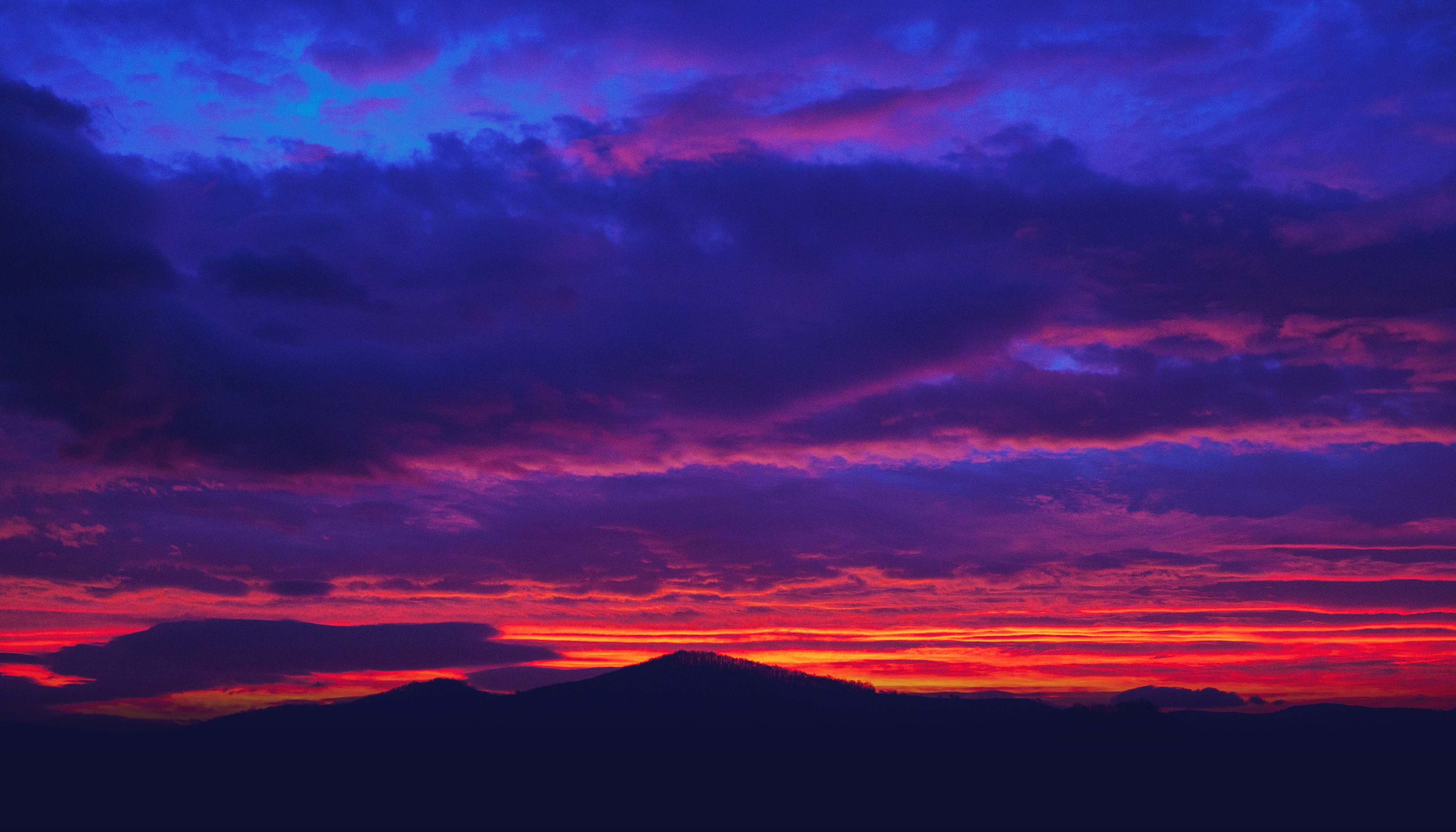 Silhouette of Mountain Under A Sunset